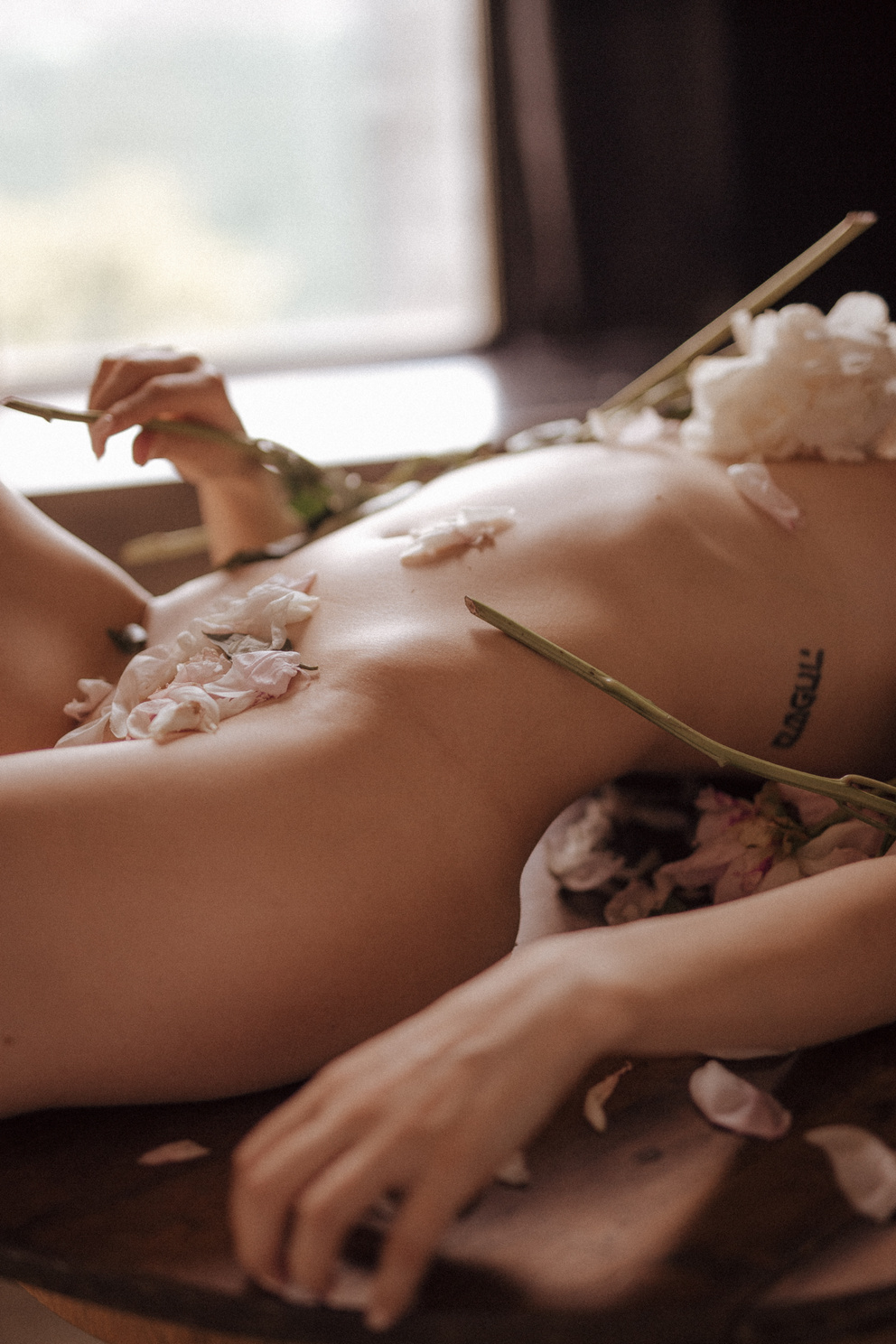  A Naked Woman Covered with Petals 